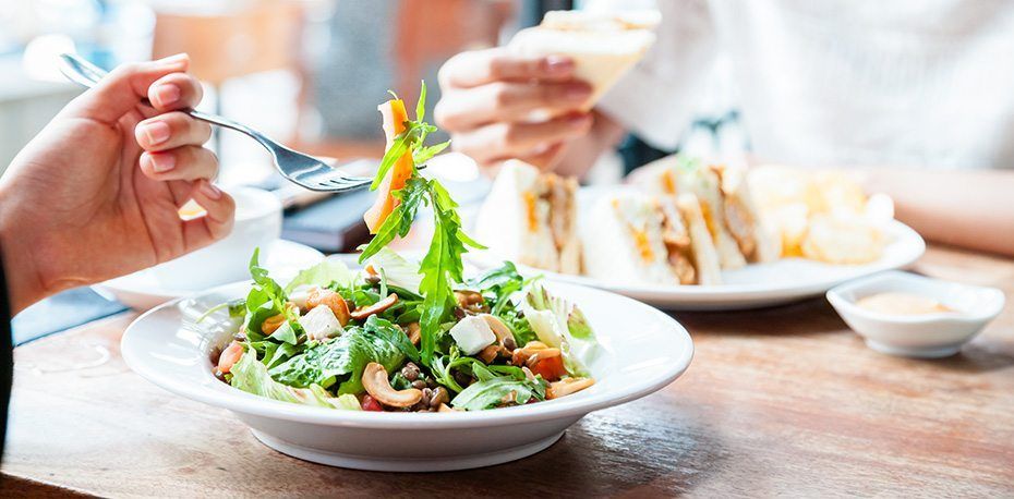 catered arugula salad with cashews and feta cheese