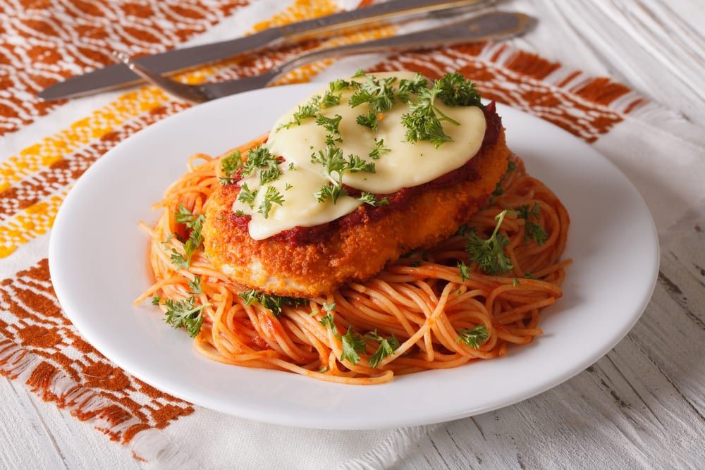 Bookmark this list of Italian catering ideas so that you remember to order dishes like this one, chicken parmesan. 