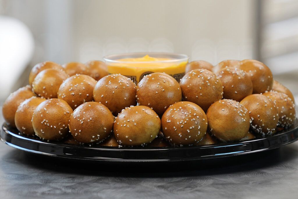 Pretzel balls with cheese dip.
