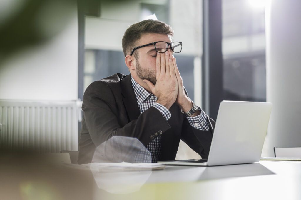 man stressed at work