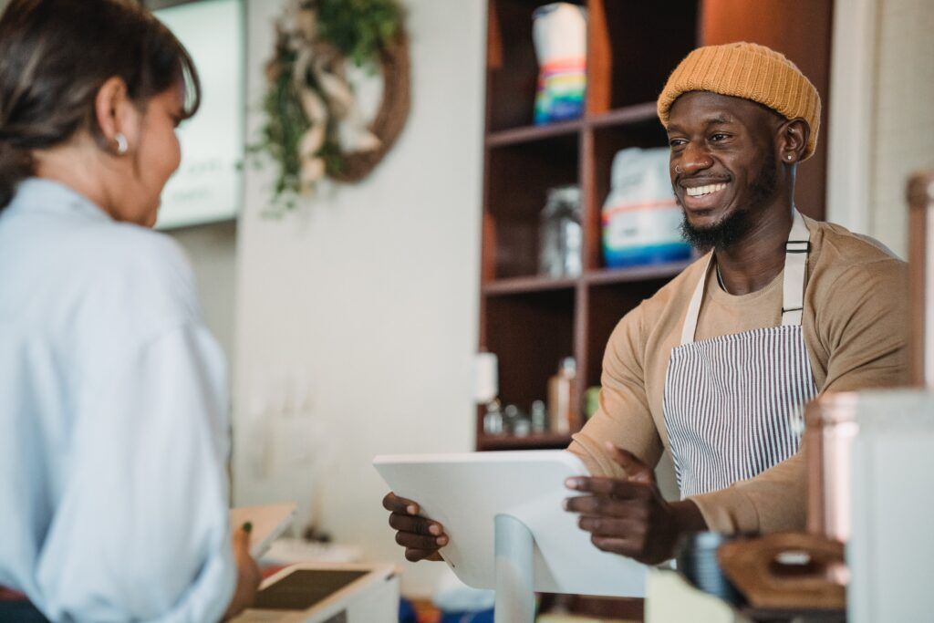 A cashier ringing up a customer. 