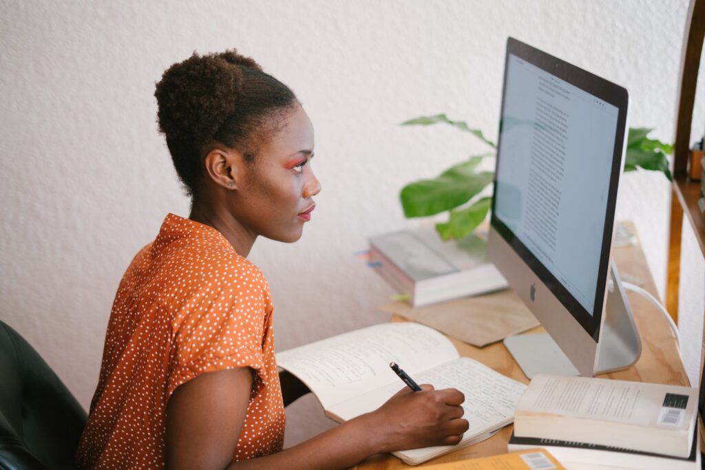 A woman sitting at a computer.