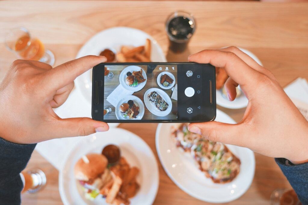 Someone taking a picture of food.