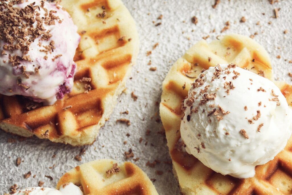 Heart shaped waffles with ice cream.