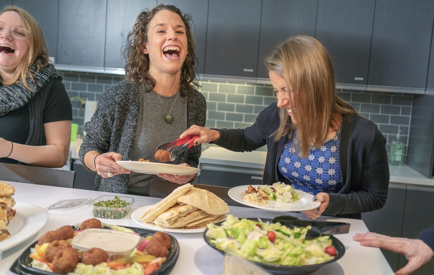 Coworkers working together during lunch