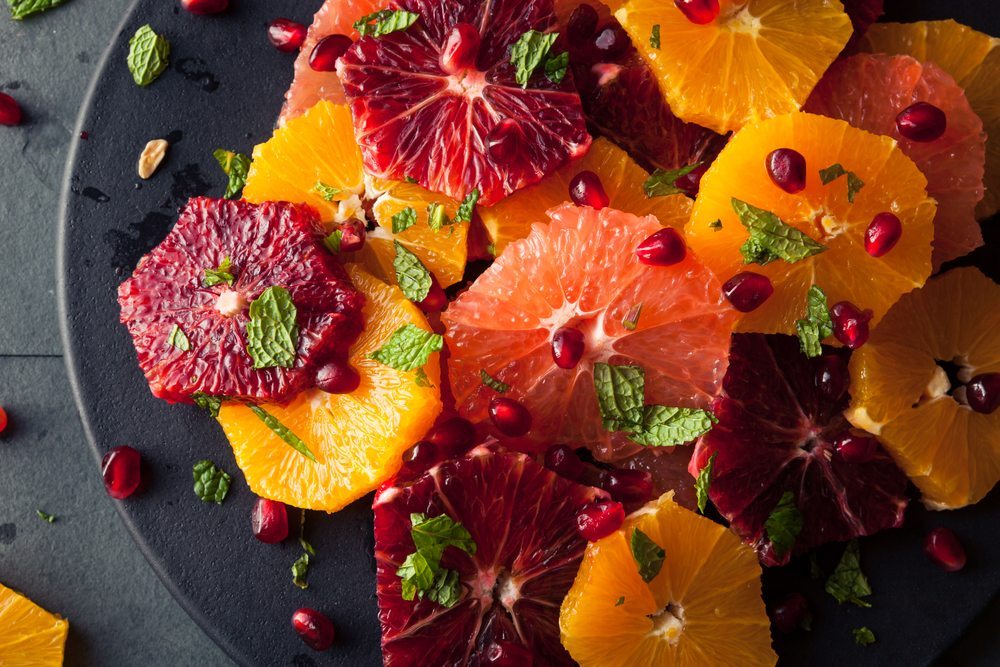Serve citrus slices with herbs and a crunchy component like pomegranate to create a unique salad.