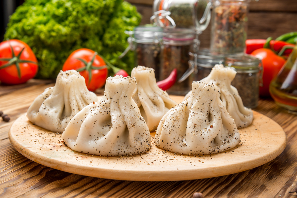 You might not be able to fly to Georgia, but you can definitely get a catering spread of traditional Georgian food delivered to your office.